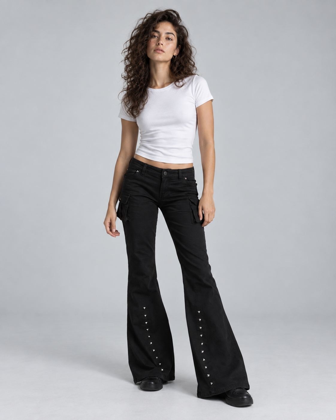 REBEL — Flared trousers with metal details — front view
