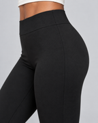 VLINE — Flared pants with crossover waistband