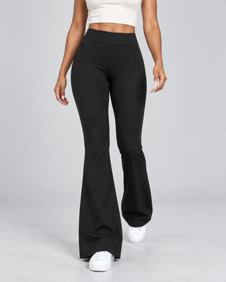 VLINE — Flared pants with crossover waistband — front view