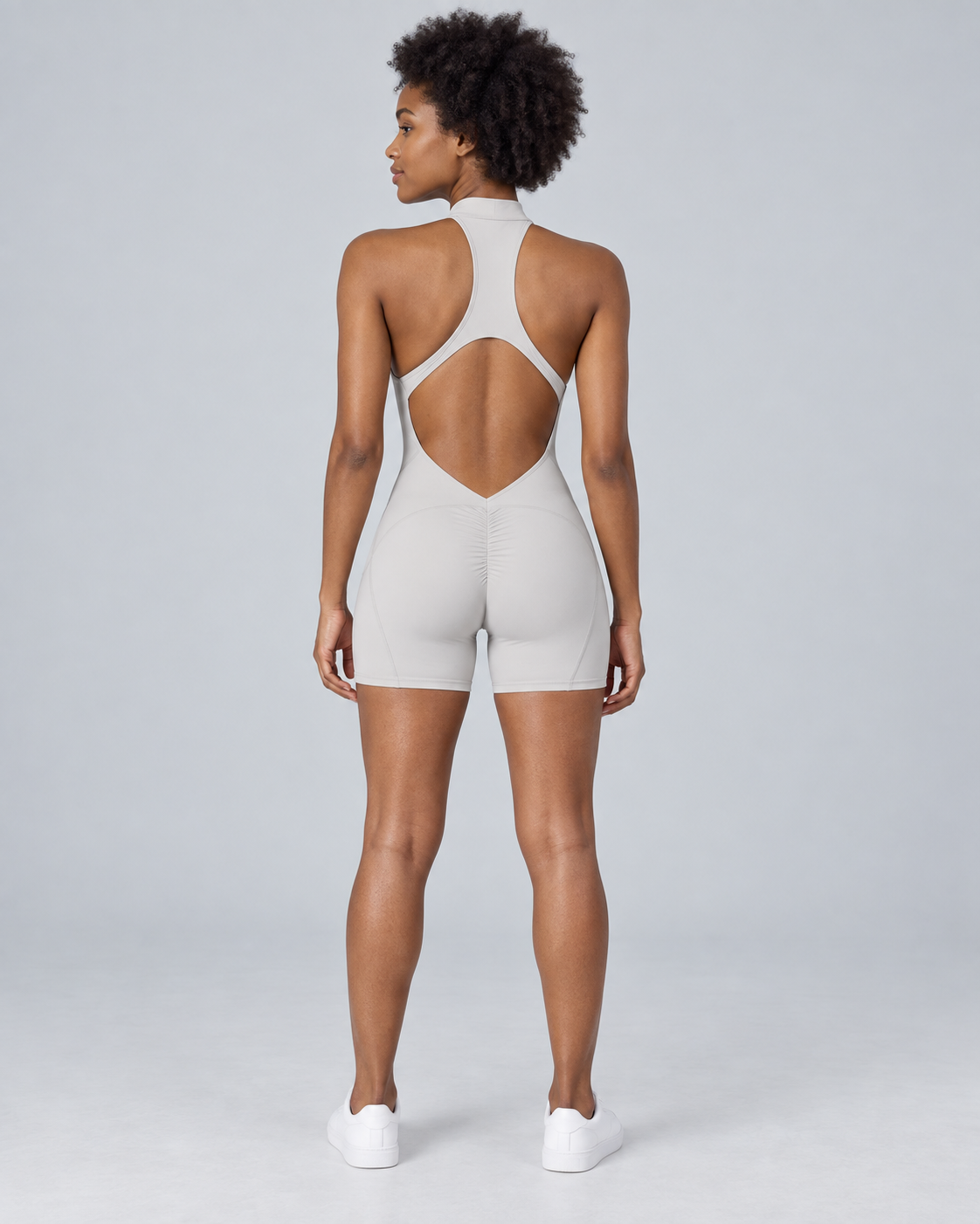 ZENITH — Zip-front open-back sports romper — back view