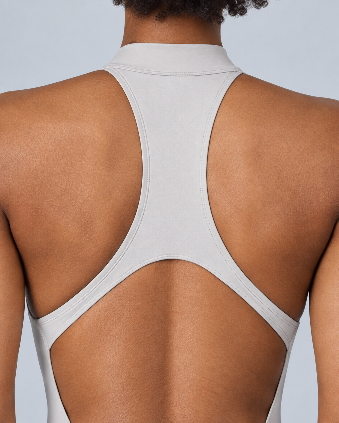 ZENITH — Zip-front open-back sports romper