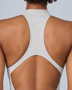 ZENITH — Zip-front open-back sports romper