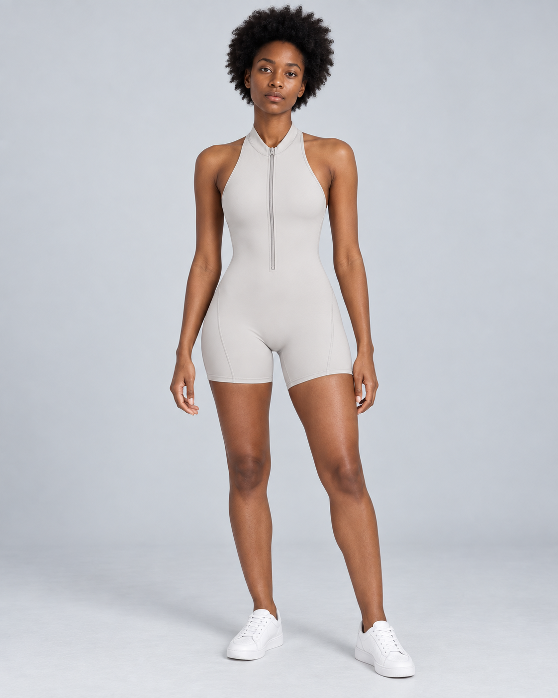 ZENITH — Zip-front open-back sports romper — front view