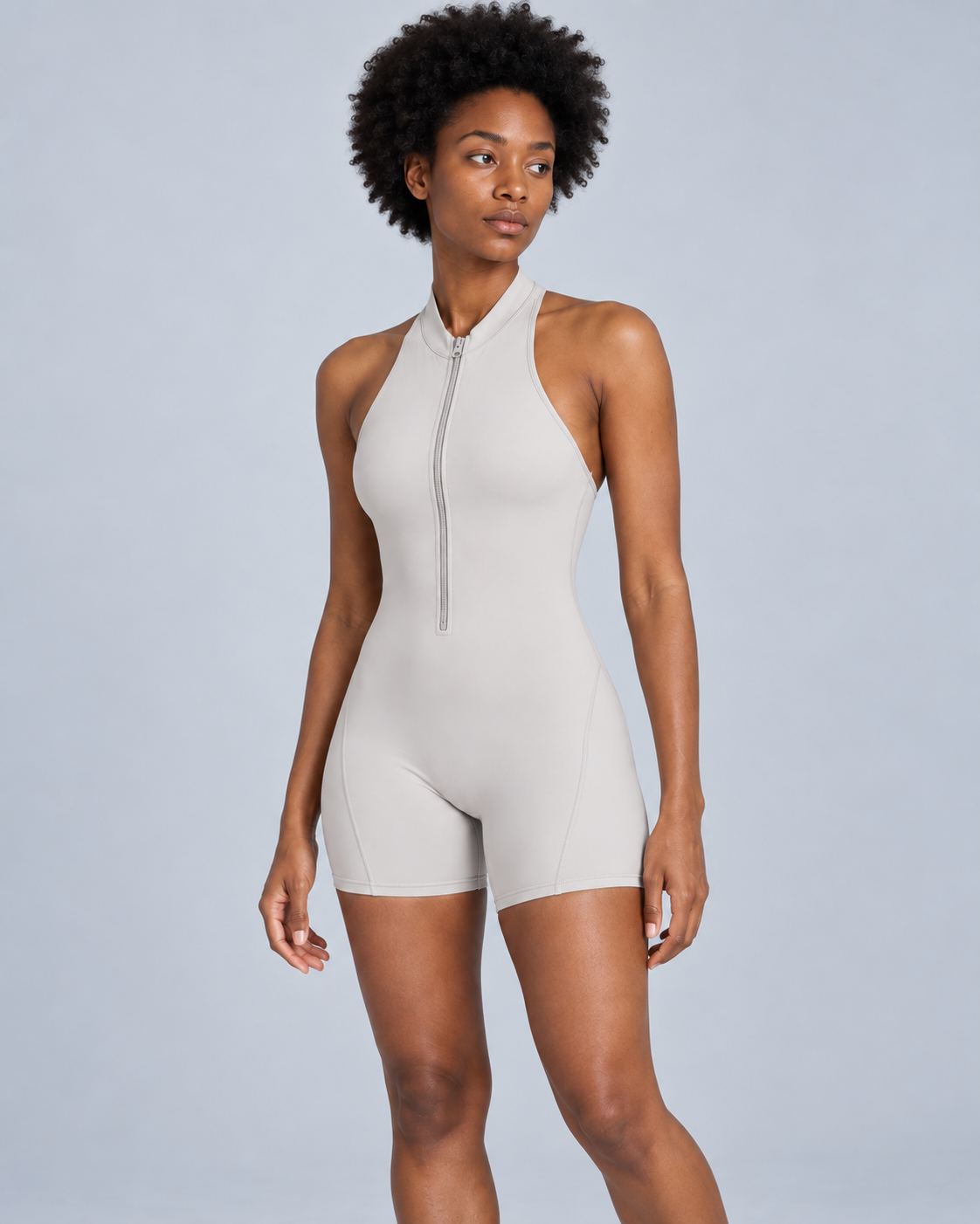 ZENITH — Zip-front open-back sports romper