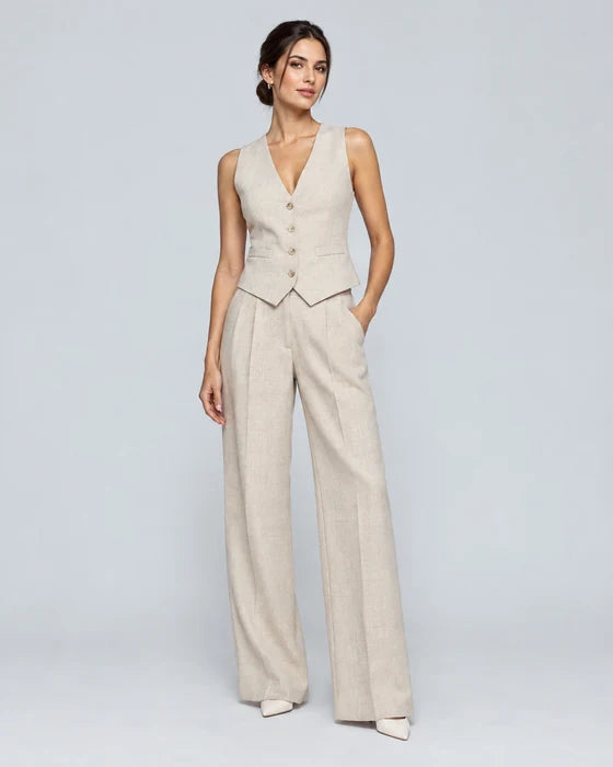 Model in a beige tailored waistcoat and wide-leg trousers