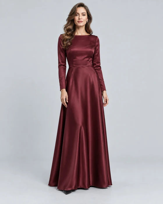 Model in a burgundy long-sleeved evening gown